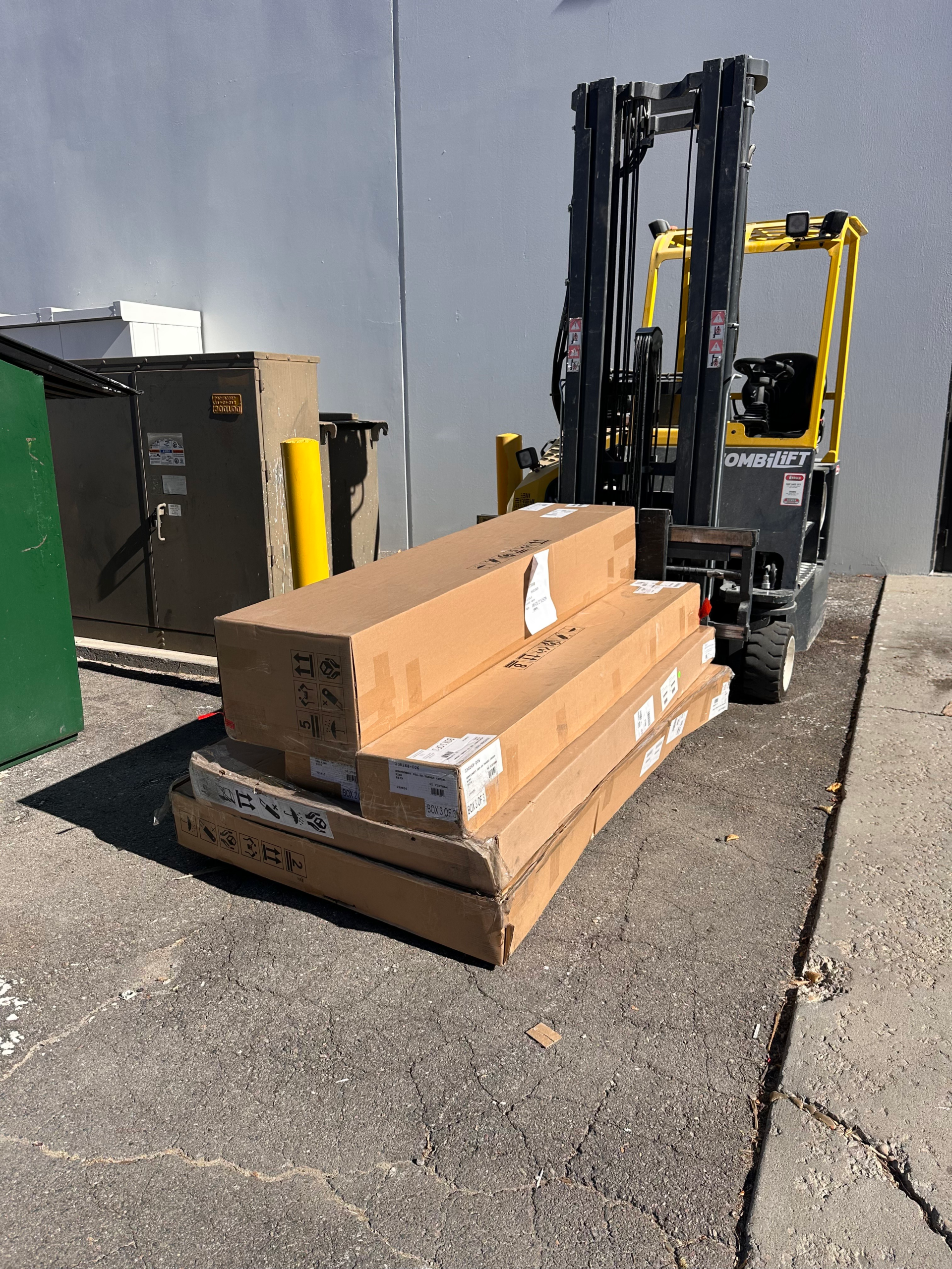 Furniture In boxes preassembly waiting for Rush Home Delivery pickup at vendor warehouse.